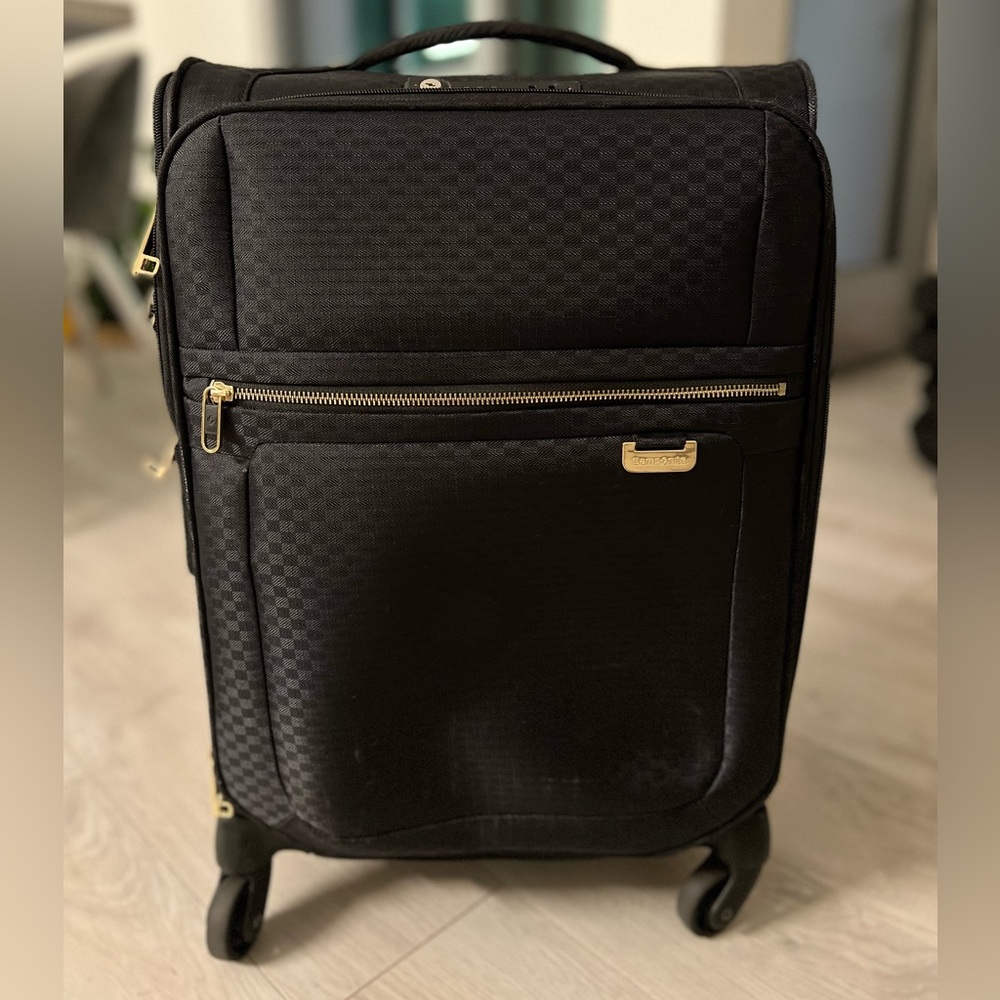 Black Samsonite feather light TSA lock with gold hardware small carry on luggage